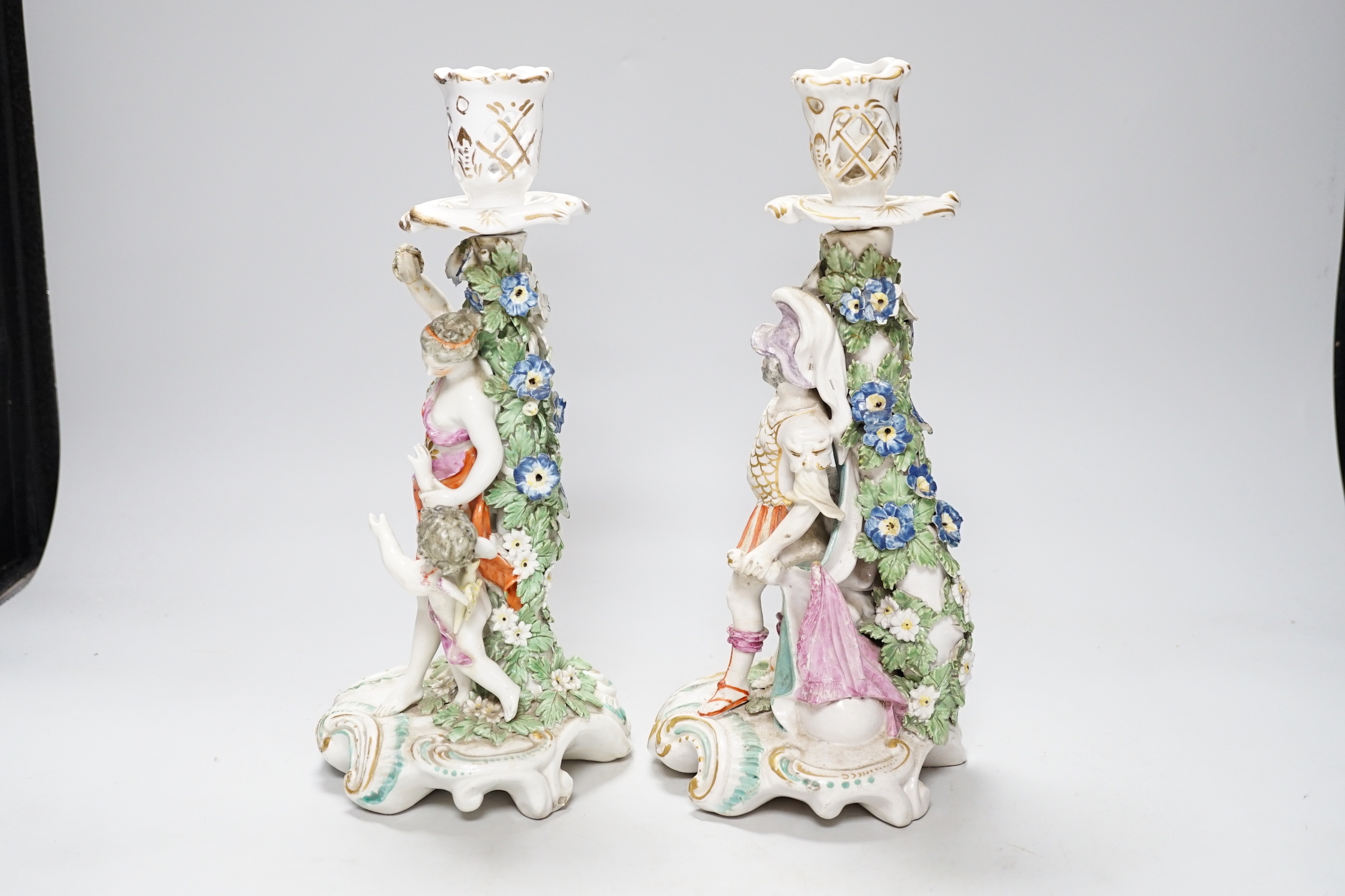 A pair of 18th century Derby figural candlesticks, 29cm